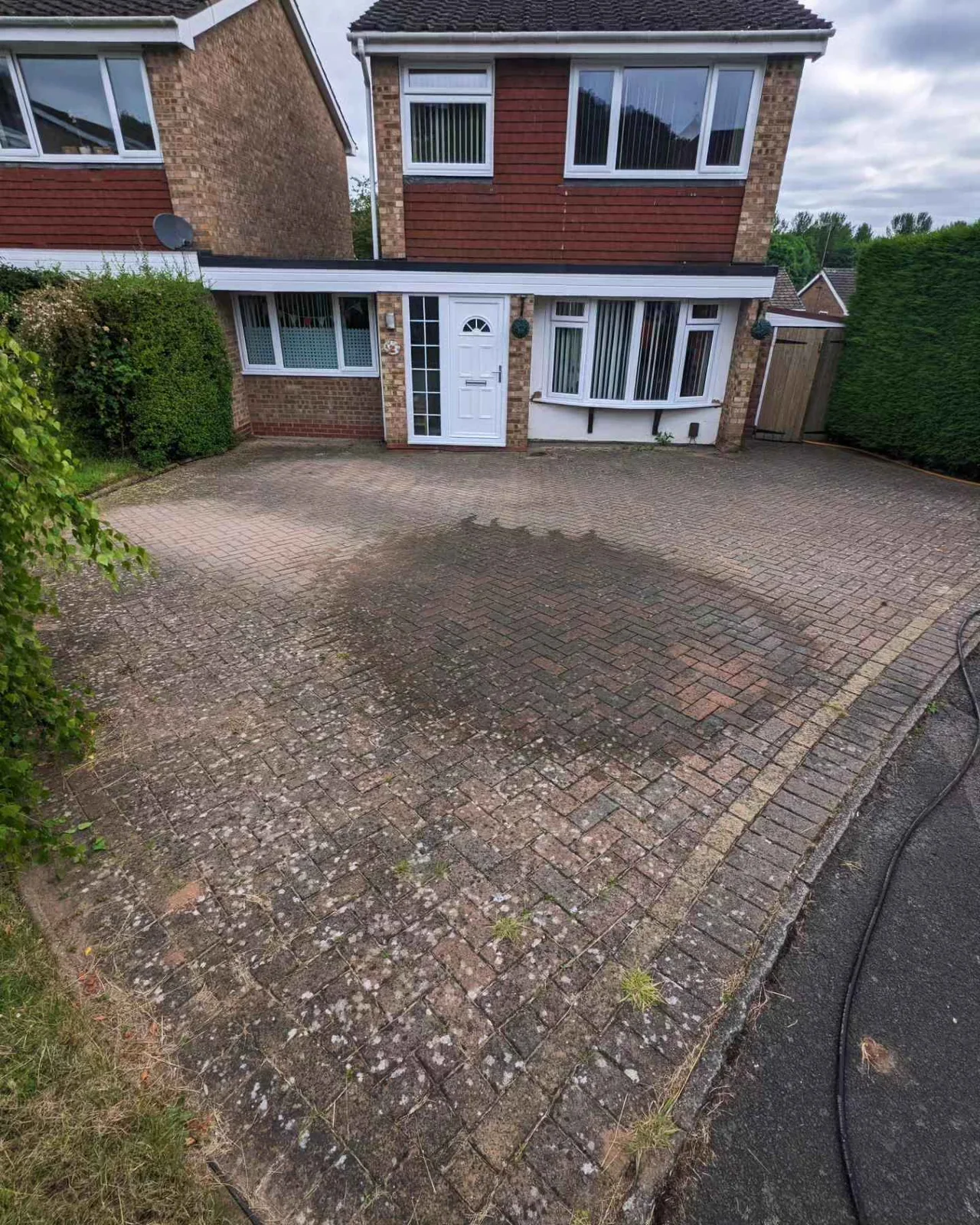 Block paved driveway before pressure washing