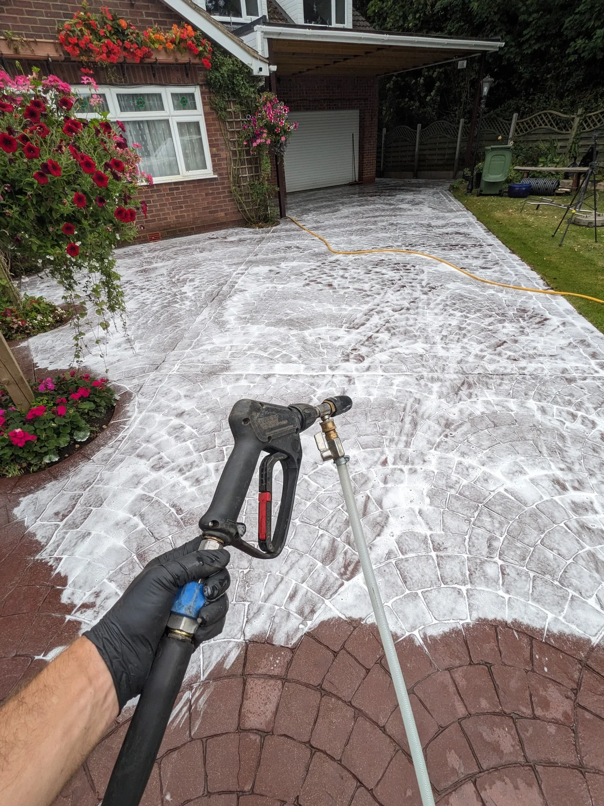 Professional chemical treatment applied during pressure washing process
